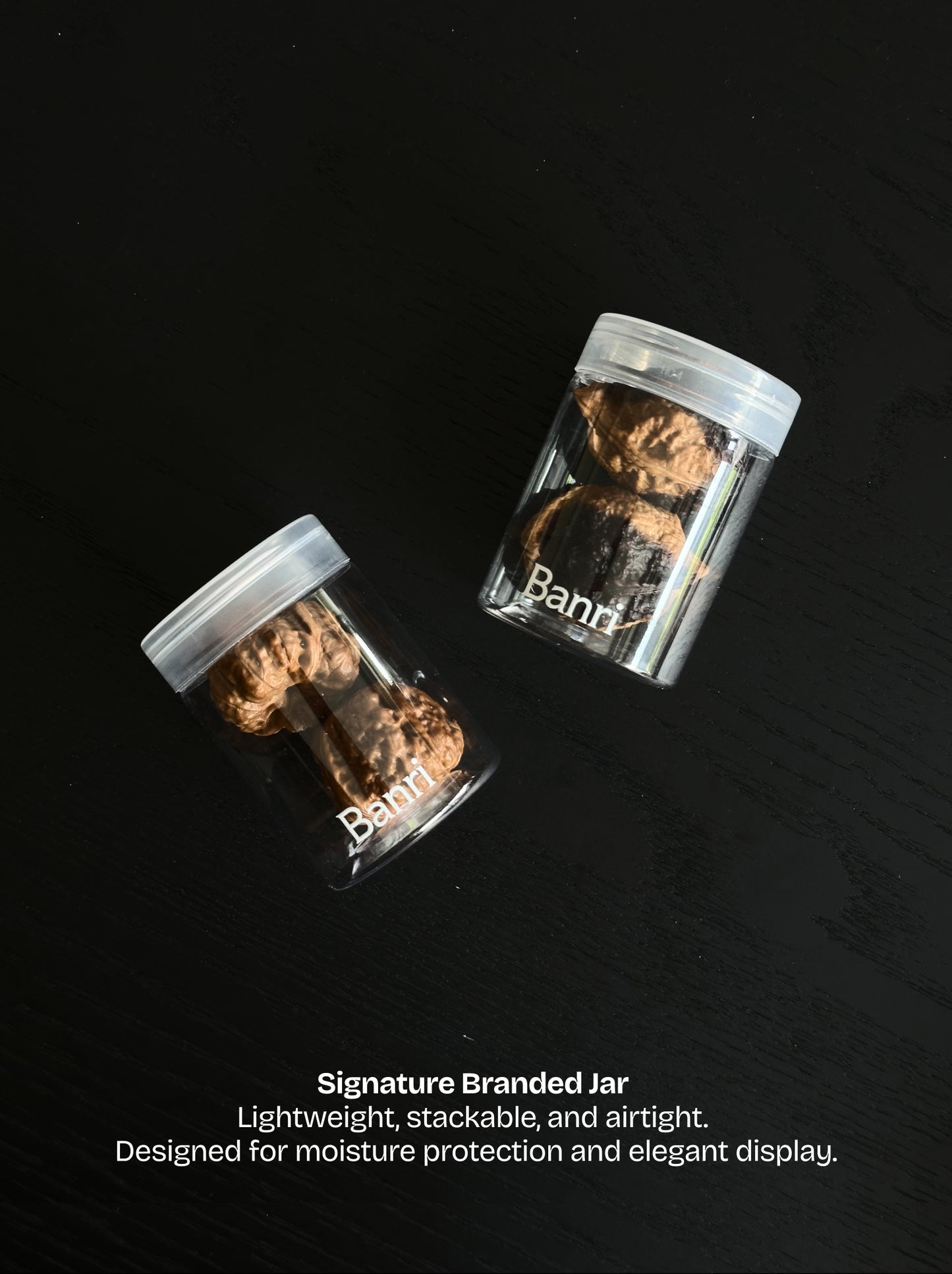 Banri Jar: a lightweight stackable and moisture-proof storage container to display Wenwan walnuts on a desk.