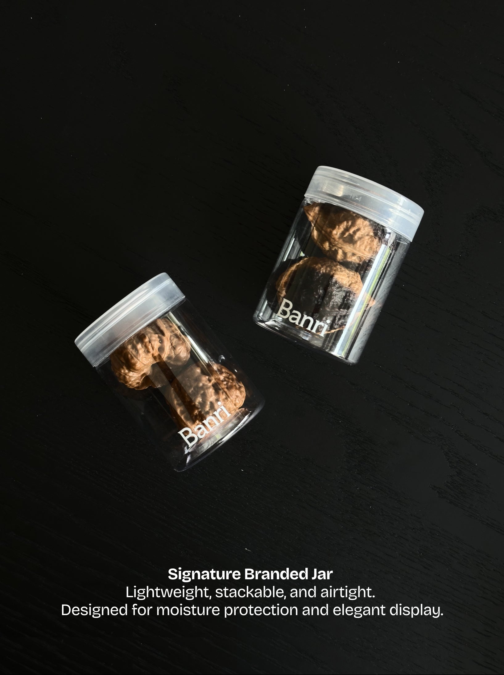 Banri Jar: a lightweight stackable and moisture-proof storage container to display Wenwan walnuts on a desk.