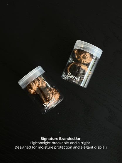 Banri Jar: a lightweight stackable and moisture-proof storage container to display Wenwan walnuts on a desk.