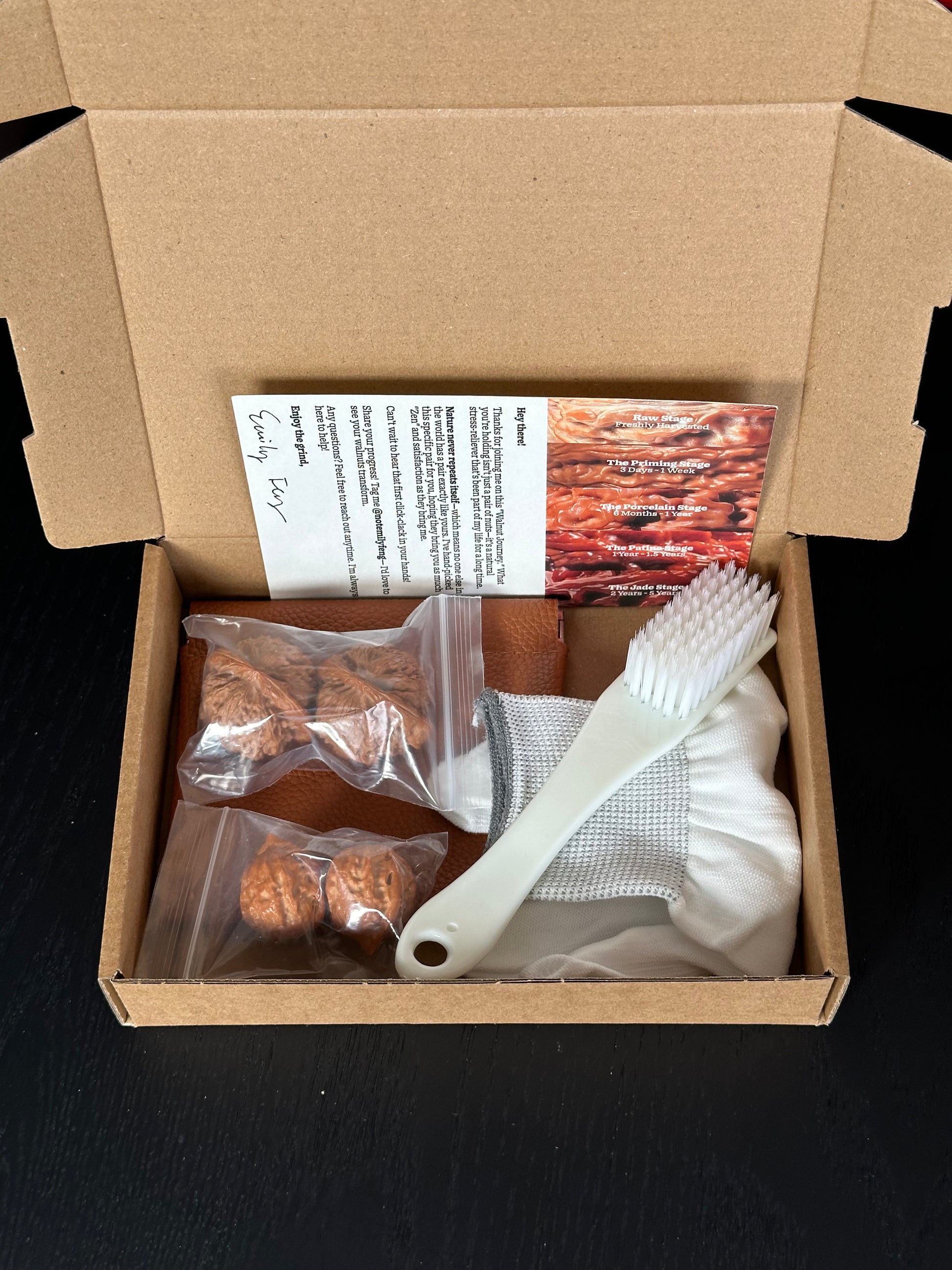 Complete Banri Wenwan walnut starter set displayed on a desk including premium walnuts, tools, and care guide.